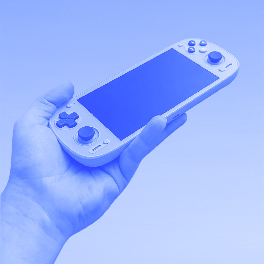Blue tinted image of hand holding Retroid Pocket G2