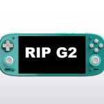 A Retroid Pocket G2 on a bright background with the text "RIP G2" displayed on the screen